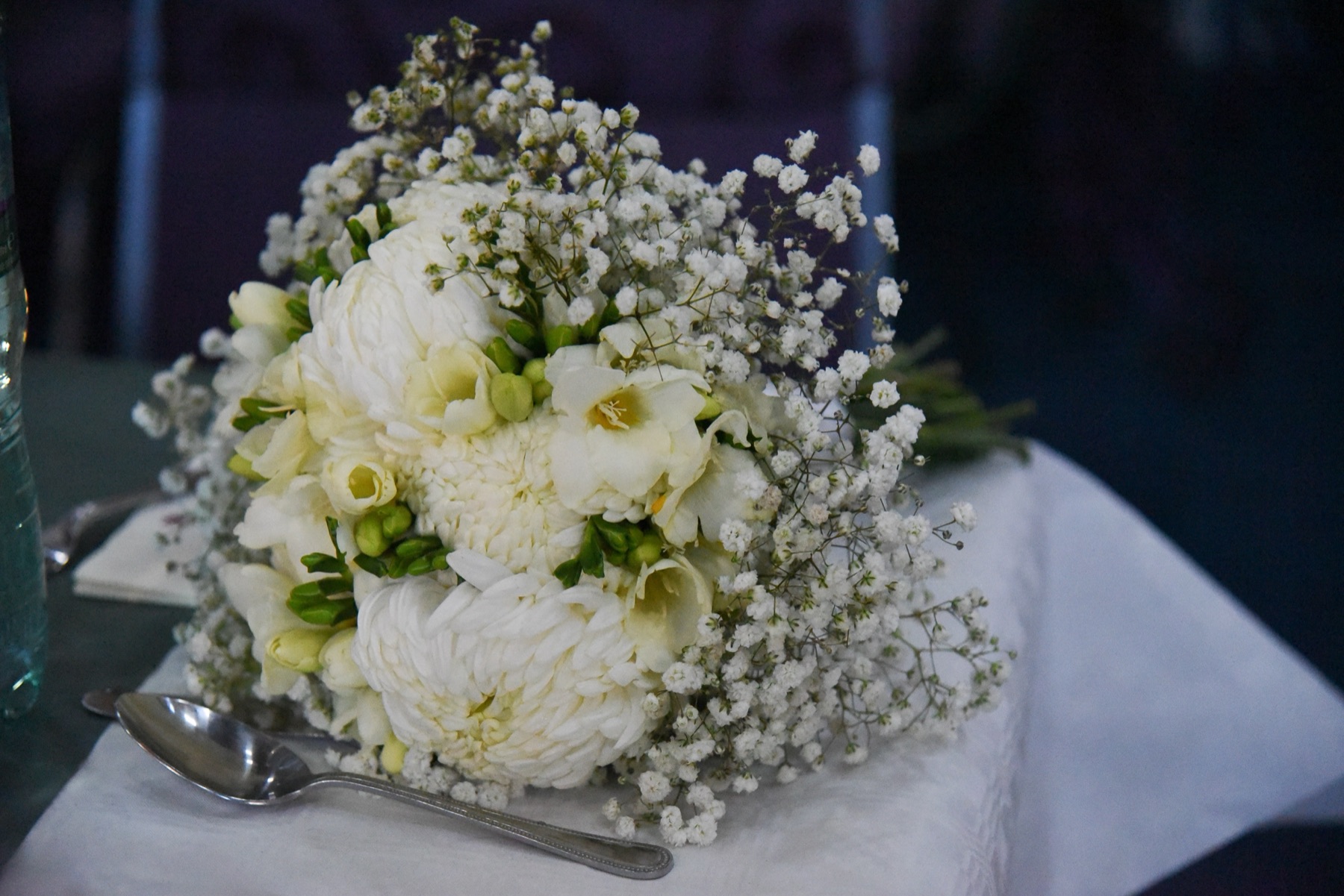 Wedding ceremony space prepared with decorated chairs and flowers at Thatcham Baptist Church